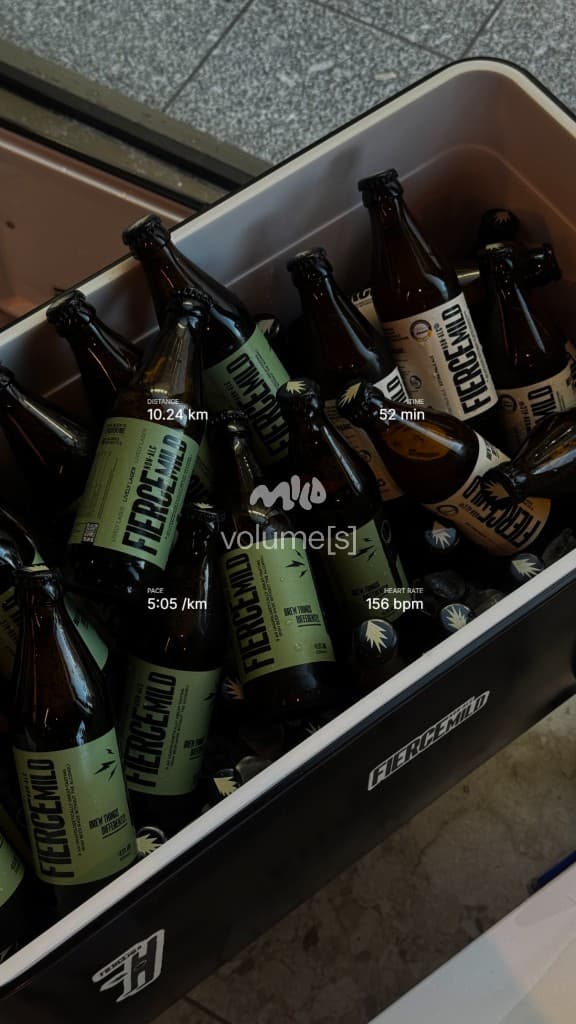 Cooler of MILD beers with a branded overlay showing distance, pace, time, and heart rate